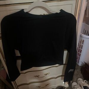 Black long sleeve cropped PINK top with thumb holes. Size medium